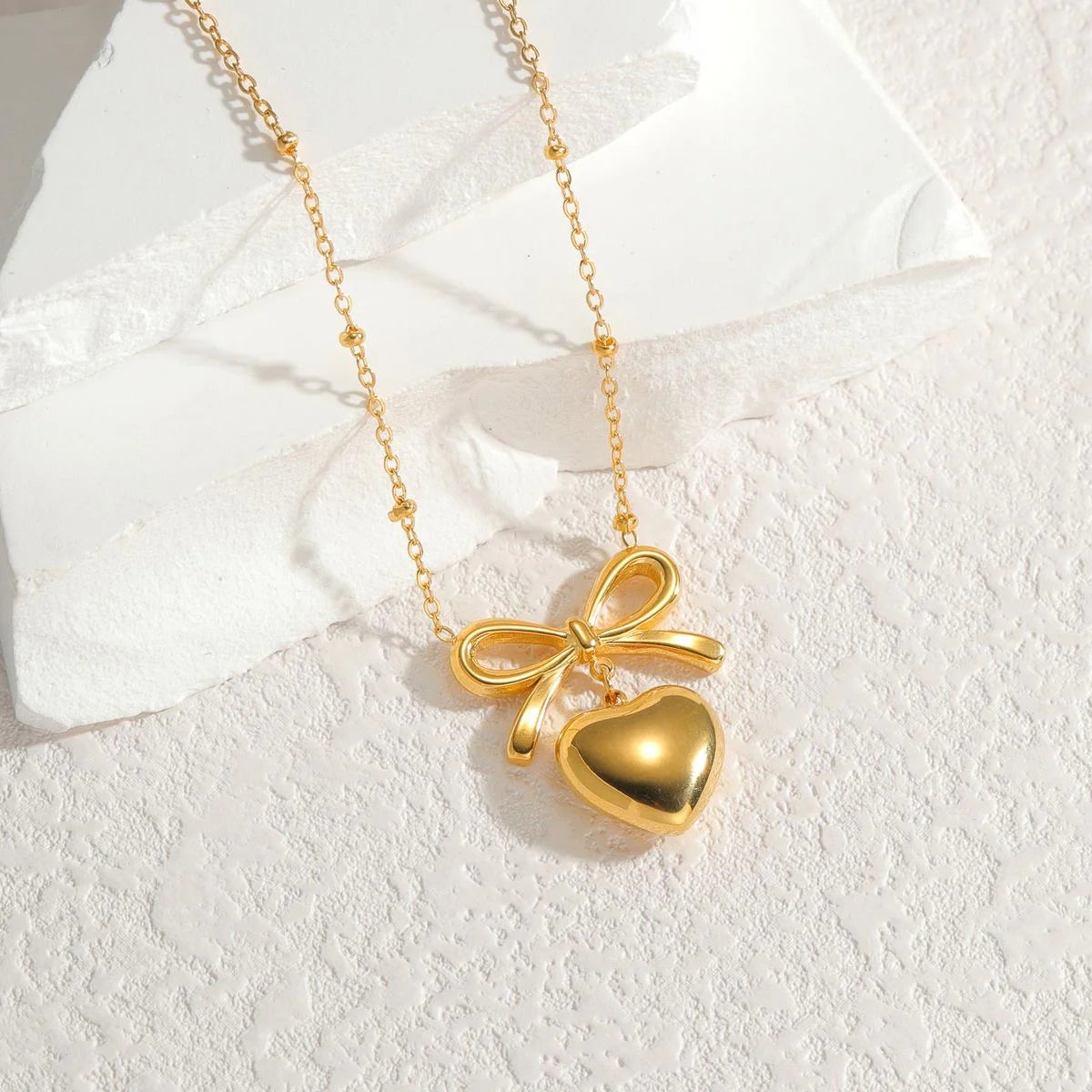 Golden love bow necklace